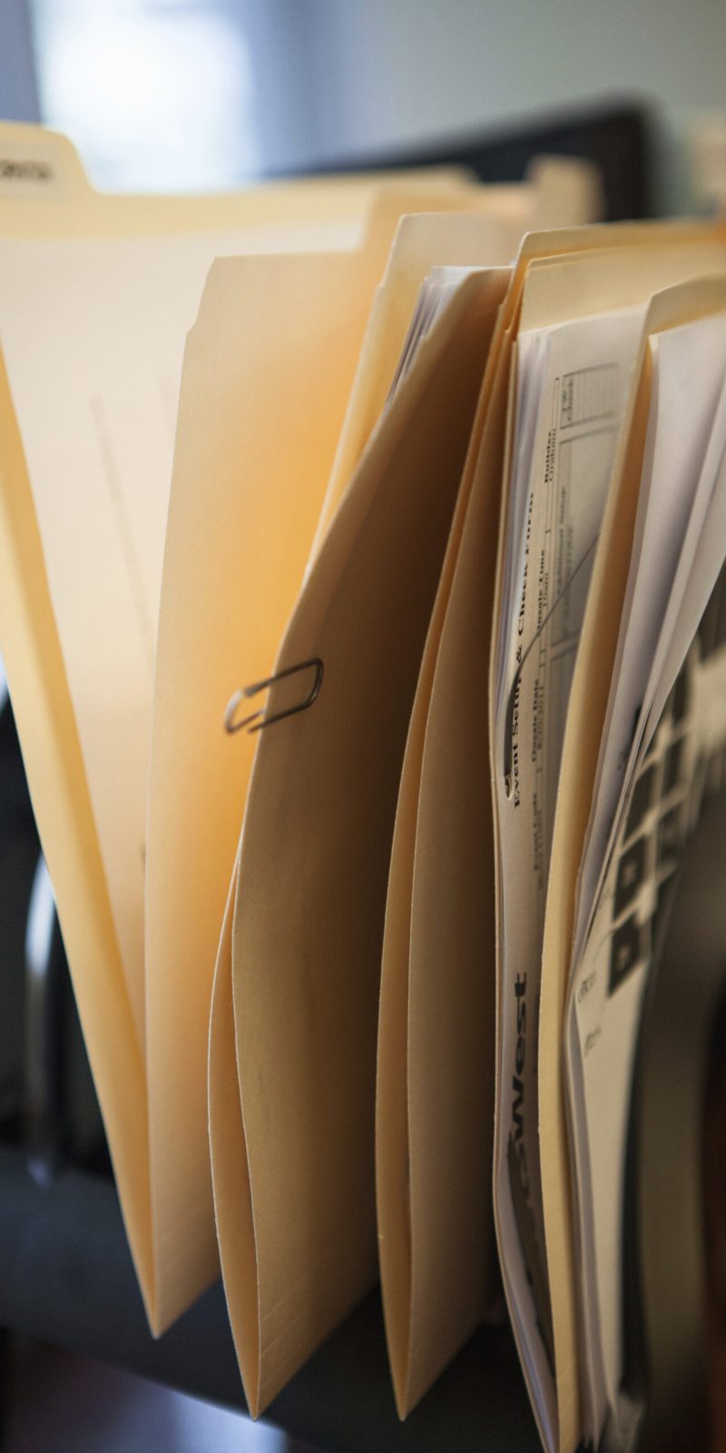 Close up of inbox row of files on office desk